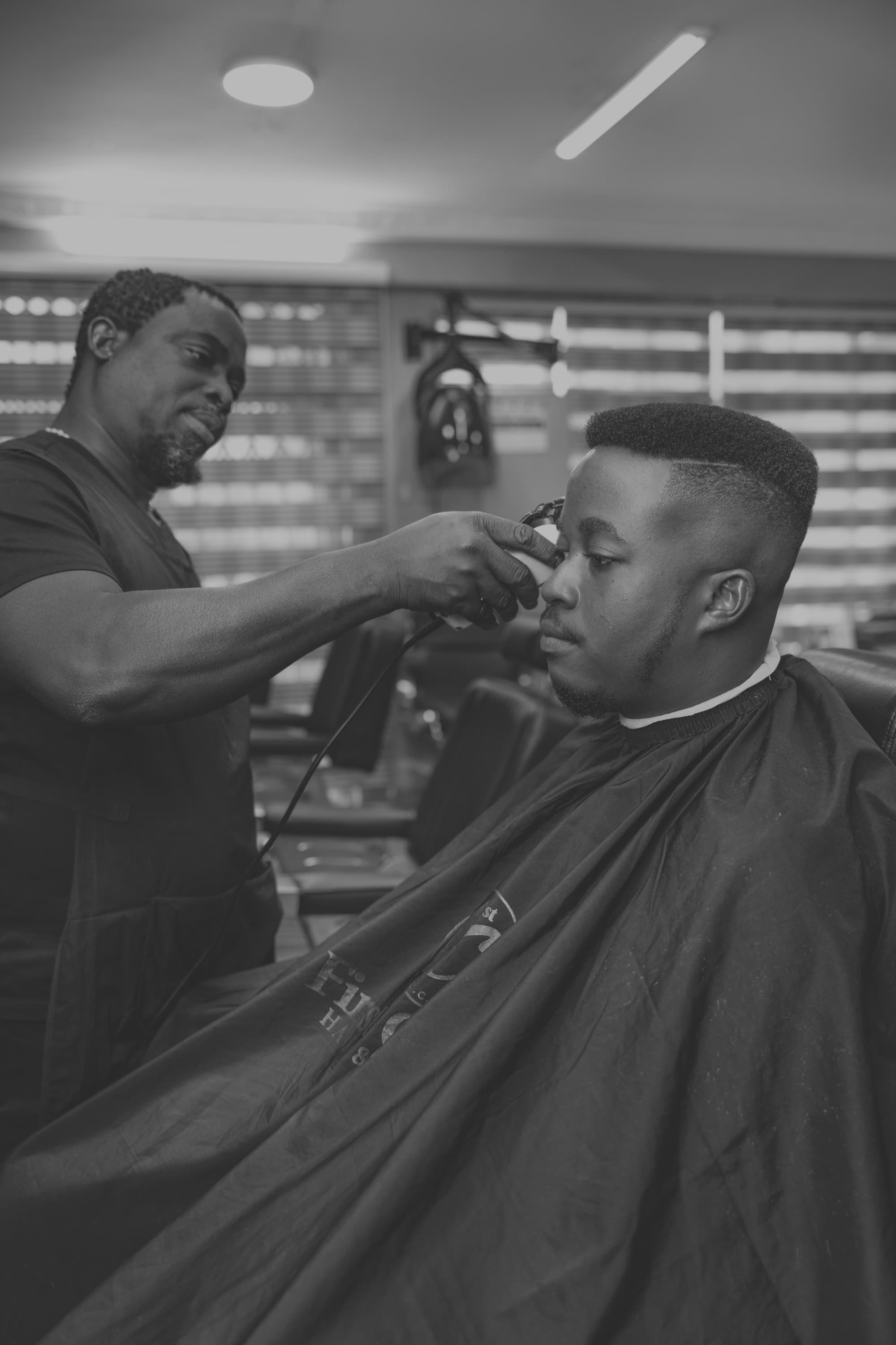 Barber cutting a client's hair